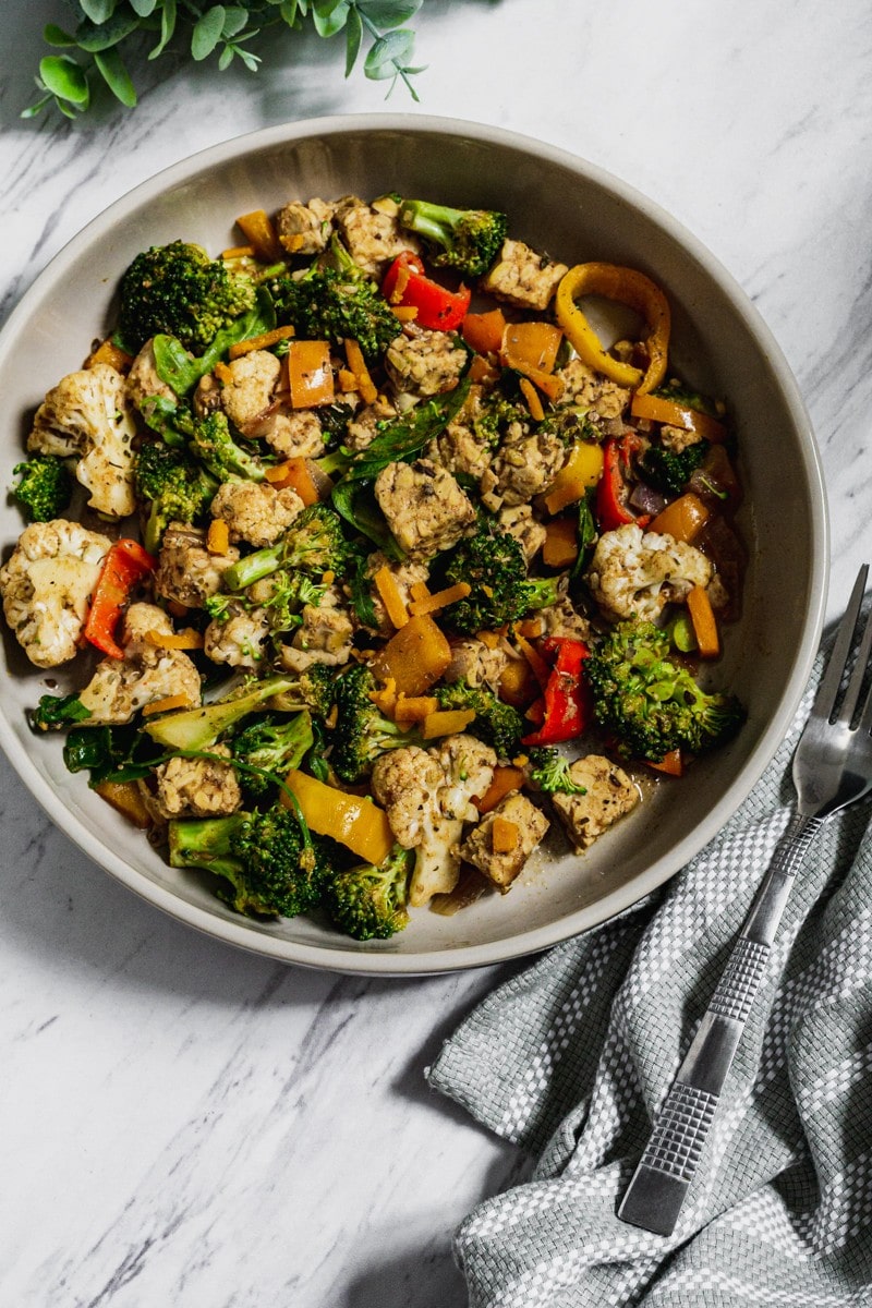 tempeh, broccoli, bell peppers, cauliflower in jerk seasoning