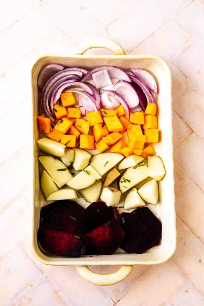 pan with onions, sweet potatoes, potatoes, beets,